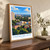 Ciudad del Este city view bordered print styled in Original angled oak-console; frame and props not included