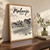 Malanje city view full-bleed print styled in Original angled oak-console; frame and props not included