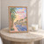 Buraydah city view full-bleed print styled in Oak frame / bedside table; frame and props not included