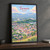 Turmero city view full-bleed print styled in Black frame / charcoal wall; frame and props not included