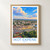 Ikot Ekpene city view bordered print styled in Front oak frame - corrected opening; frame and props not included