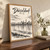 Düsseldorf city view full-bleed print styled in Original angled oak-console; frame and props not included