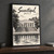 Sevastopol city view full-bleed print styled in Black frame / charcoal wall; frame and props not included