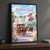 Mackinac Island Main Street full-bleed print styled in Black frame / charcoal wall; frame and props not included