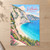 Porto Katsiki beach from the cliff stairs full-bleed print styled in Unframed sheet - corrected A-series; frame and props not included