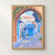 Chefchaouen blue medina lane full-bleed print styled in Front oak frame - corrected opening; frame and props not included