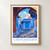 Chefchaouen blue medina lane bordered print styled in Front oak frame - corrected opening; frame and props not included