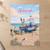 Aldeburgh fishing boats on shingle full-bleed print styled in Unframed sheet - corrected A-series; frame and props not included