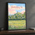 Glastonbury Tor from the levels full-bleed print styled in Black frame / charcoal wall; frame and props not included