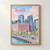 Seattle city view full-bleed print styled in Front oak frame - corrected opening; frame and props not included