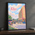 Kitwe city view full-bleed print styled in Black frame / charcoal wall; frame and props not included
