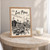 Las Piñas city view full-bleed print styled in Oak frame / bedside table; frame and props not included