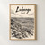 Lubango city view full-bleed print styled in Front oak frame - corrected opening; frame and props not included