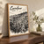 Carrefour city view full-bleed print styled in Original angled oak-console; frame and props not included