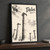 Delos full-bleed print styled in Black frame / charcoal wall; frame and props not included