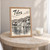 Tilos full-bleed print styled in Oak frame / bedside table; frame and props not included