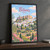 Patmos full-bleed print styled in Black frame / charcoal wall; frame and props not included