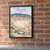 Nisyros full-bleed print styled in Black frame / exposed brick; frame and props not included