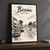 Bissau city view full-bleed print styled in Black frame / charcoal wall; frame and props not included