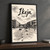 Ikeja city view full-bleed print styled in Black frame / charcoal wall; frame and props not included