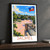 Jacmel city view bordered print styled in Black frame / charcoal wall; frame and props not included