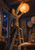 An adult craftsperson stands on a wooden step ladder and hangs a glowing paper lantern in a workshop with a night window and workbench.