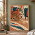 A Bengal-patterned cat stretches toward a crumpled paper ball across a geometric rug in a furnished room.; frame shown for styling only