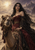 Woman in a burgundy gown and black mantle beside a decorated camel, with patterned textiles and distant towers in a warm haze.