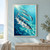 Five reflective silver-blue fish swim in a loose turning formation through bright aquamarine water and bubbles.; frame shown for styling only