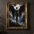 Dark-clad woman with enormous black feathered wings standing on a rocky rise before pale clouds.; frame shown for styling only