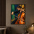 Adult woman cellist with lowered gaze bowing an amber cello against an emerald and ultramarine performance-room background.; frame shown for styling only