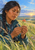 Adult woman in a teal outdoor jacket examines a red-orange flower against a bright prairie landscape, with binoculars at her chest.
