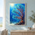 A branching sea fan coral fills the right side of a blue underwater scene as silver and orange fish pass through the reef.; frame shown for styling only