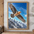 Pale-headed, rust-accented raptor with broad dark wings flying above jagged snowy alpine peaks under a vivid blue sky.; frame shown for styling only