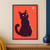 Upright black cat with a curled tail looking up at a small pale-pink balloon against a coral-red background.; frame shown for styling only