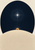 Radiating white star above a pale curved horizon and partly obscured amber planet in a deep-blue oval.