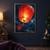 Large glowing red-orange paper lantern with a trailing tassel against diagonal rain, dark blue sky and distant waterside lights.; frame shown for styling only