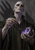 Bald robed man holding a small plant sprig and glowing purple crystal against a stone wall.