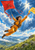 Adult in a saffron flight suit hangs above a mountain valley, holding a red kite line and reaching toward a yellow scarf beneath blue clouds.