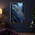 Luminous cuttlefish-like cephalopod with turquoise and rose-gold markings gliding through a dark blue reef canyon among small fish.; frame shown for styling only
