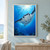 A manta ray with broad fins and pale underside swims toward sunlit blue water above dark reef silhouettes, small fish, and bubbles.; frame shown for styling only