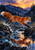 A red fox leaps rightward across a rocky stream, with water below and pine trees and mountains beneath an apricot sunset.
