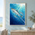 Three silver-blue fish swim diagonally through turquoise and deep blue water, with bubbles and bright rays entering from the upper right.; frame shown for styling only