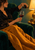 Adult woman pouring red wine into a stemmed glass from a green armchair, with a dark cat, gold blanket, and glowing lamp.
