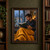 Bearded man in a dark sweater reading an open book beside a rainy window, with blurred city lights, plants, a cup, and a mustard-yellow blanket.; frame shown for styling only