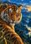 A close-up tiger with amber eyes and orange-black stripes faces forward against a blue mountain river landscape with a waterfall and sunset.