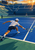 Tennis player in a white cap and shirt lunging toward a yellow ball on a blue court, with an opponent across the net.