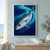 Silver-blue fish with dark markings swimming diagonally through deep blue water, surrounded by a sweeping turquoise current and bubbles.; frame shown for styling only
