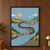 Cream uppercase slogan follows a winding dark road through a blue cut-paper landscape of hills, water, trees, and clouds; a small van appears on the lower road.; frame shown for styling only
