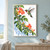 A jewel-green hummingbird with a red throat hovers beside coral trumpet flowers on a leafy vine against white.; frame shown for styling only